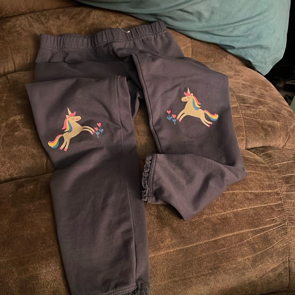 Gray pants with picture of horses on both knees